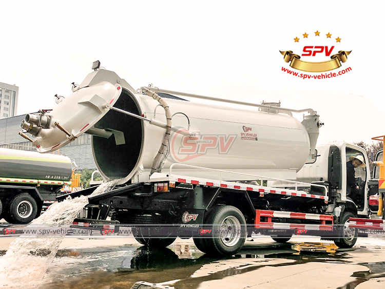 Wastewater Vacuum Truck Discharging Water From Rear Door
